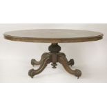 A large Victorian oval walnut loo table,on carved column base and four legs,173cm wide134cm deep