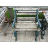 A cast iron garden suite,comprising a table and a pair of chairs, with hounds head arms (3)