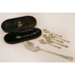 A set of five silver teaspoons, hallmarked, a cased pair of sugar tongs with cherub detail, and a
