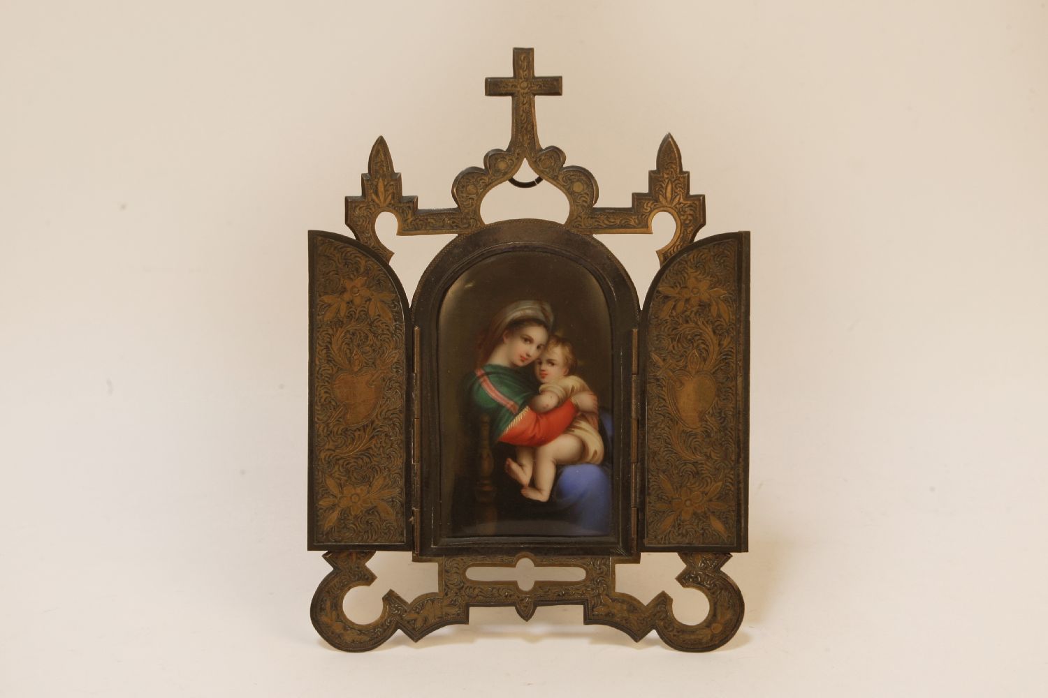 A porcelain icon possibly KPM depicting a panel of The Madonna and child in a gilt/plated stand, - Image 2 of 2