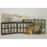 An assortment of vintage cigarette cards