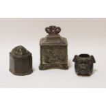 A small 18th century pewter lidded box, with lions mask detail, one other similar, and a bulldog