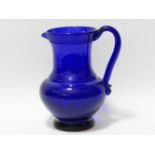 A 19th century Bristol blue glass jug, with loop handle