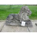 A pair of composition stone lions, 38cm high