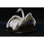 Royal Doulton 'Images of Nature' porcelain figure group of swans, 'Nestling Down' HN3531