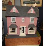 A modern doll's house and contents, on plinth with garden drawer. 100cm high