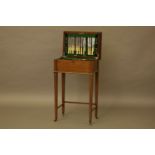 A Walker & Hall ten place canteen, in a fitted mahogany cabinet, 53cm wide