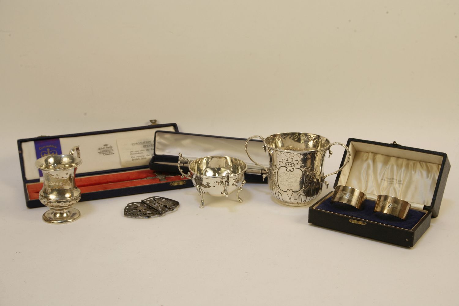 A silver christening mug, a jug, a tyg, a pair of napkin rings marked STG, an Elizabeth II - Image 2 of 2