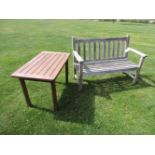 A teak garden seat, with slatted back and seat, 122cm wide, together with a small slatted garden