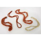 Two single row twig coral necklaces, a single row woven micro coral beads necklace, and a single row