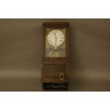 An early to mid 20th century 'The Gledhill time recorders' electrically propelled wall clock,