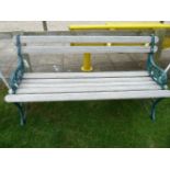 A garden bench, with iron ends and hardwood slats153cm wide