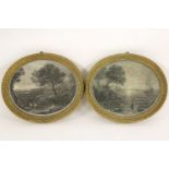 A pair of oval engravings, sun rising/sun set scenes, in giltwood frames