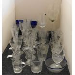 A collection of 19th century and later etched glassware, wine glasses, beakers, bottle decanters,