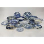 A collection of blue and white transfer printed tablewares, to include a large early 19th century