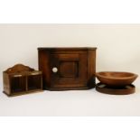 A small Victorian oak hanging corner cupboard, a hanging letter rack and two treen bowls