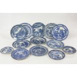 A quantity of 18/19th century blue and white transfer printed plates, largely oriental designs to