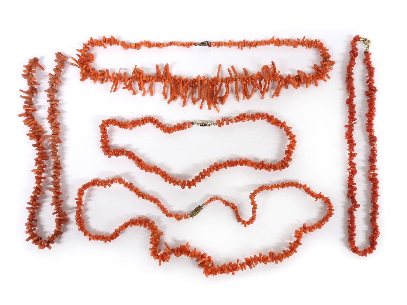 A collection of coral jewellery, to include a single row graduated coral twig necklace, six other