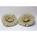 A pair of plaster ceiling bosses, painted and gilt, some damage, 37cm diameter