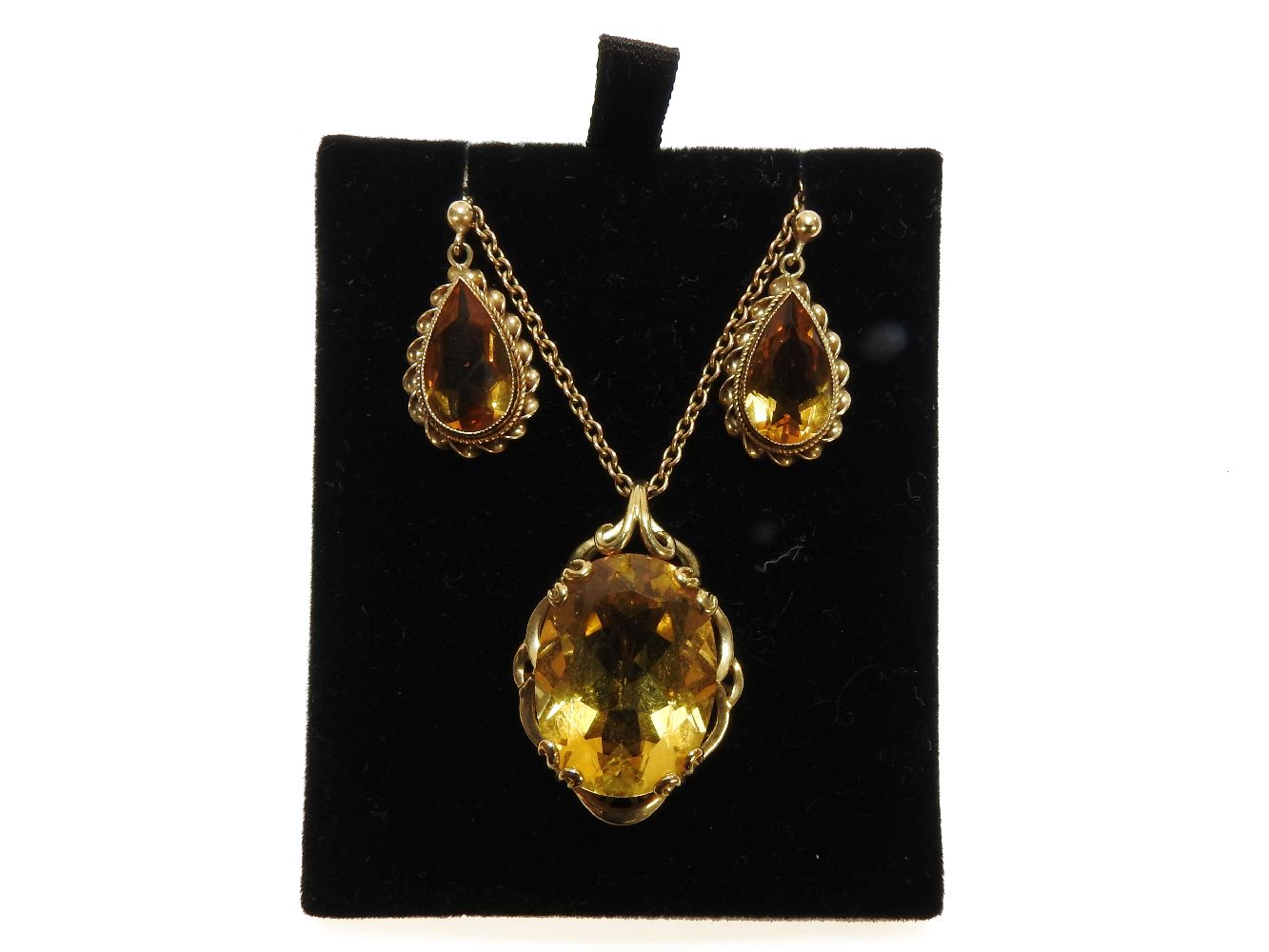 A 9ct gold single stone oval cut citrine pendant, on a gold chain, marked 9k, and a pair of gold - Image 2 of 2