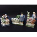 Three Rye pottery figures 'The Lovers', 'The Swineherd', and The Gardener', the largest 25cm high