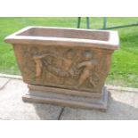 A terracotta planter on a stand