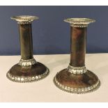 A pair of tortoiseshell and silver dwarf candlesticks, with gadrooned detailing