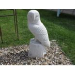 A cast stone sculpture of a giant barn owl, 78cm high