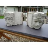 A pair of cast stone corbels of a king and queen, 23cm wide x 31cm deep x 23cm high