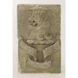 A carved stone armorial,in two parts, with a lion mask above an heraldic banner,each part 45 x