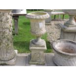 A garden urn and plinth, 105cm high