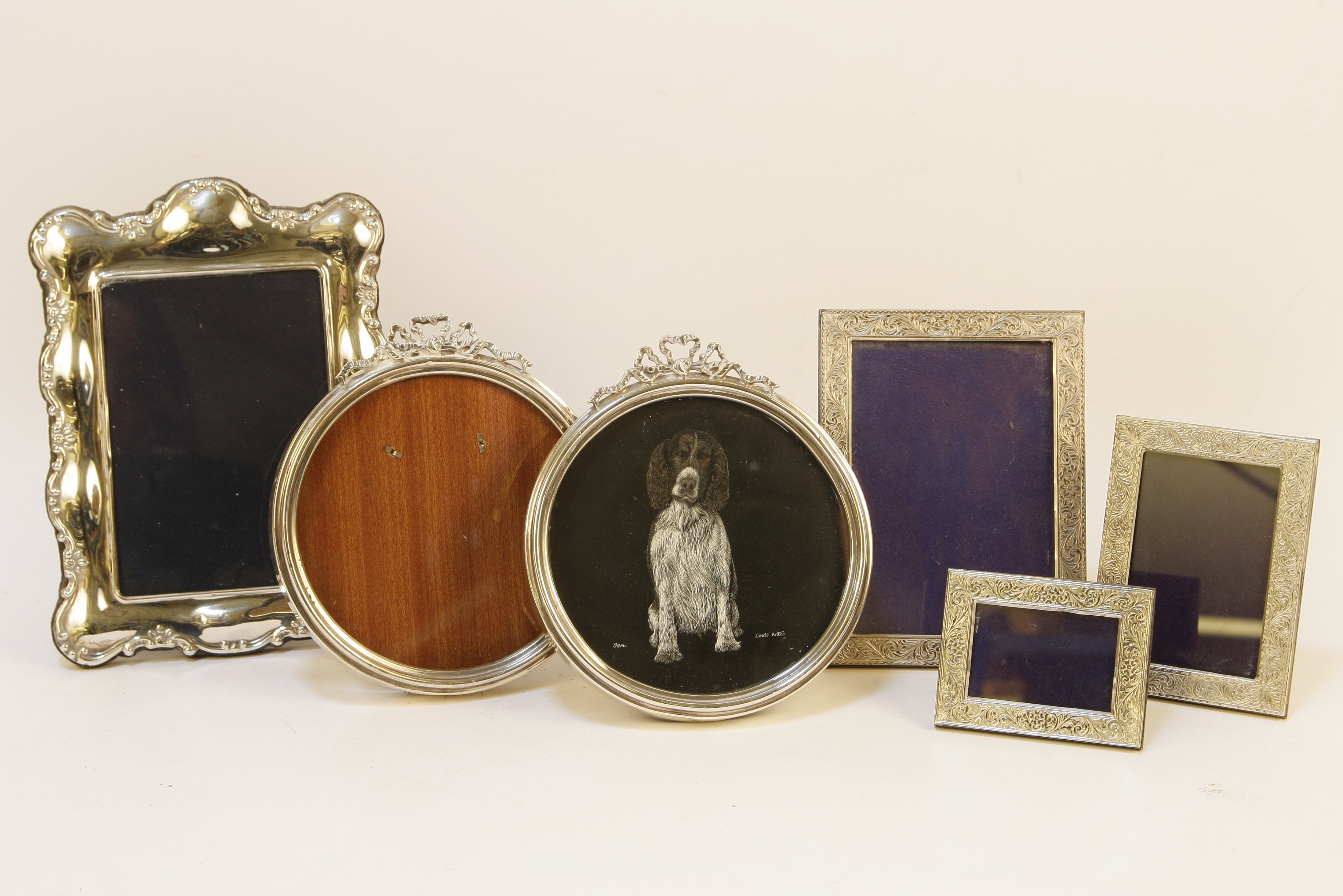 Six silver photo frames