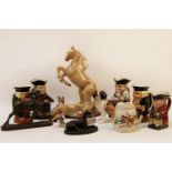 A Beswick model of a fox, other porcelain animals, and a collection of Toby jugs, and a McKinley