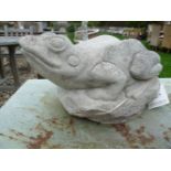 A garden sculpture of a frog in cast stone, 20cm high x 39 cm long
