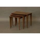 A nest of three Heals walnut tables, on slender supports, 58cm wide, 35cm deep, 45cm high