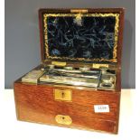 An early Victorian rosewood dressing case, with fitted interior, fitted silver topped bottles, and