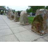 A set of six carved limestone staddle stone bases of square spreading form