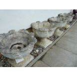 Four reconstituted concrete urns, 40cm high