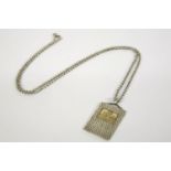 A small silver and gold St Christopher inset pendant on chain, hallmarked to reverse