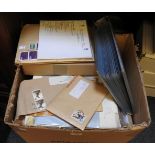 A box of royal wedding postage stamps and albums