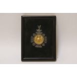A framed and glazed 'Ancient Order of Foresters' medal