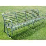 An iron slatted garden bench, 244cm long