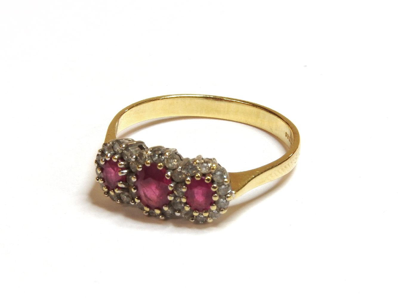 An 18ct gold ruby and diamond regal cluster ring