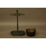 A cast iron stick stand, and a brass preserve pan