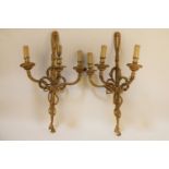 A pair of brass three light wall sconces, in the Neo classical style