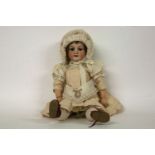 An Armand Marseille bisque head doll,with eyes/open/shut, mouth open, numbered 390 n. A.2.M,