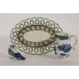 A Caughley jug, a novelty shoe shaped pot, damaged/cracked, and a Wedgwood oval dish