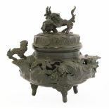 A Japanese bronze koro, 19th century, with cover and liner, cast in openwork with playful shi-shi,