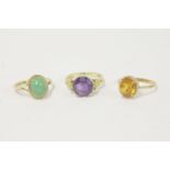 A 9ct gold single stone amethyst ring, a 9ct gold single stone citrine ring, and a 9ct gold