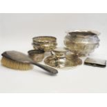 A silver Capstan inkwell, a cigarette case, hairbrush, and three Indian or Burmese silver bowls (6)
